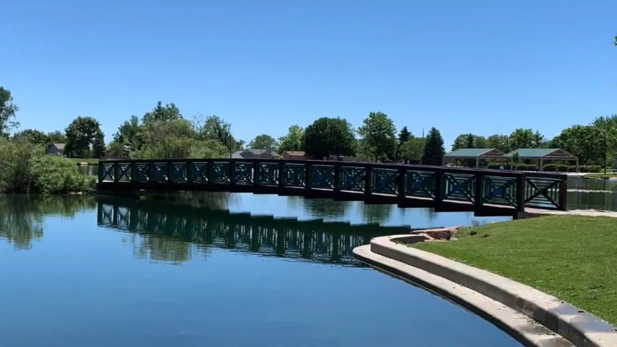 Pedestrian bridge over Webster Lake at E.B. Rains Jr. Memorial Park in Northglenn, Colorado