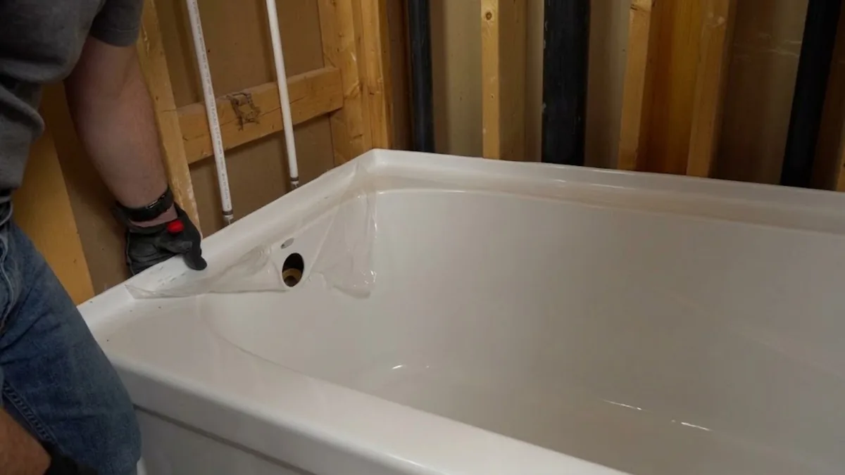 New bathtub installed during an open-wall bathroom remodel