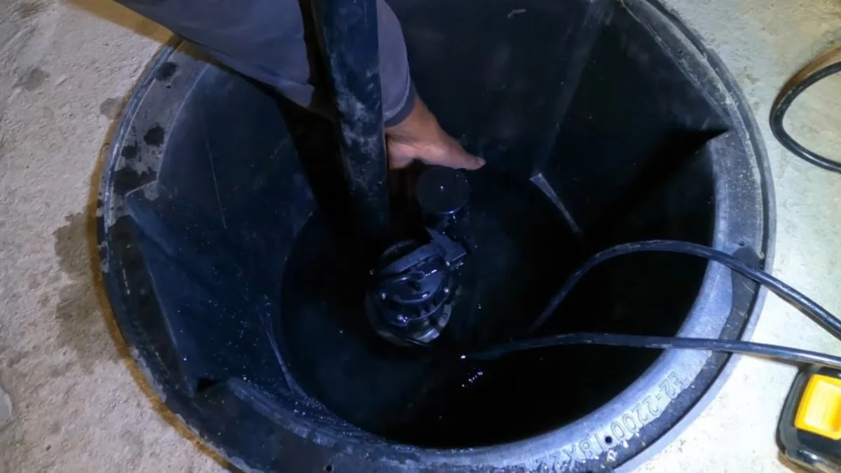 Sump pump installed inside a basement sump pit